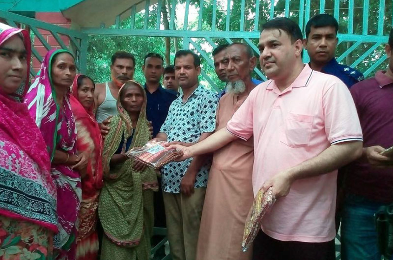 Biswas Group of Industry supporting community development in Bangladesh by helping underprivileged families, building mosques, providing COVID-19 vaccinations, and ensuring educational opportunities for underprivileged children